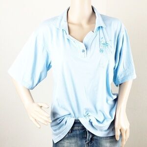 Young light blue floral embroidered top